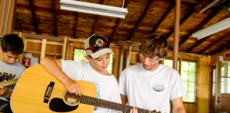 Lessons on Guitar in summer camp playing musical
